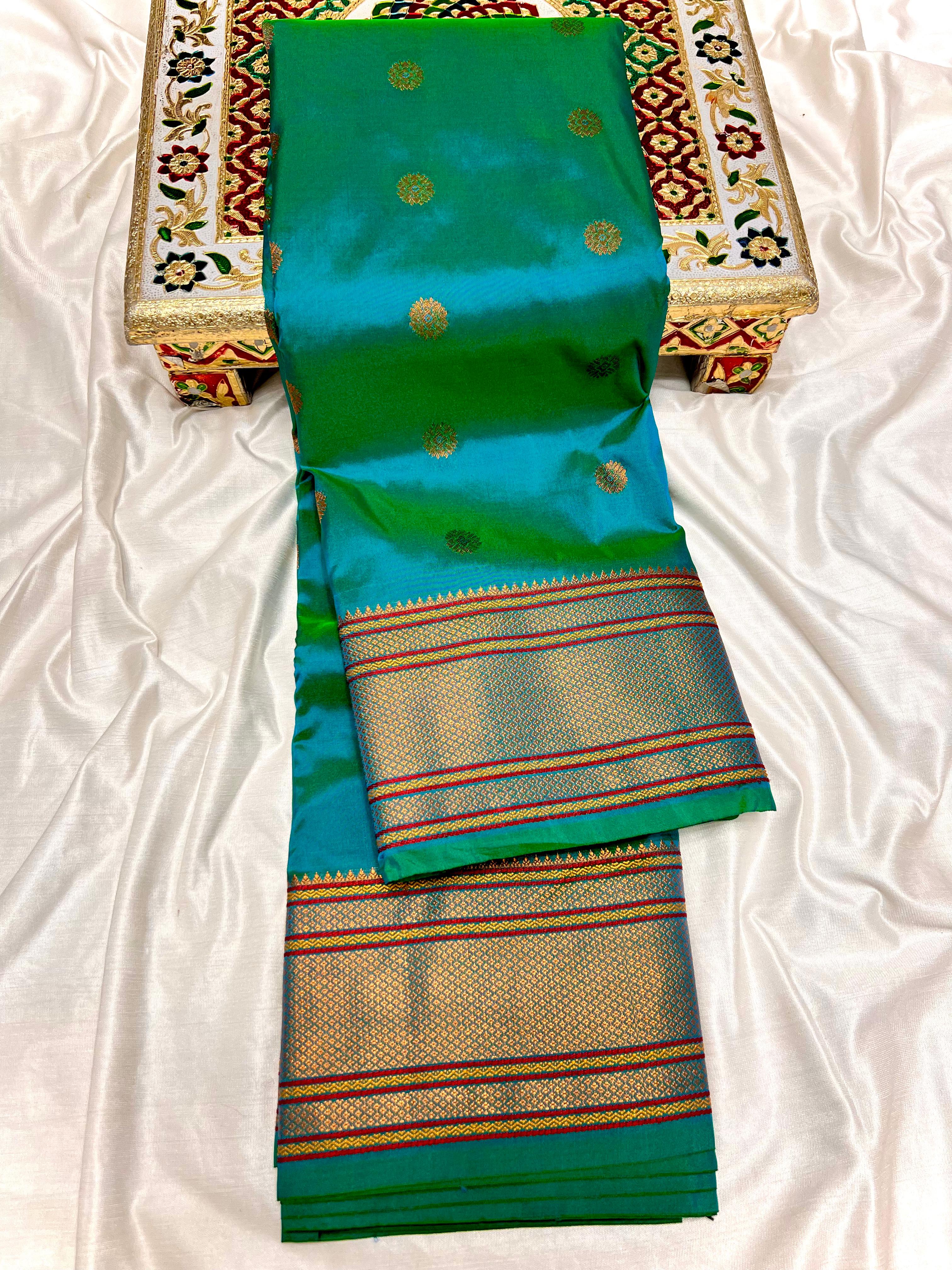 Traditional Kalanjali Paithani, Maharani Pallu with running Blouse.  This traditional Yeola Kalanjali Paithani features a rich Maharani Pallu and intricate all over buttis. Made with premium shiny Tana Softy Silk and 100% premium Zari, it offers a luxurious look and feel. The running blouse piece allows for a customized fit. Elevate your wardrobe with this premium paithani saree. Traditional Yeola Kalanjali Paithani